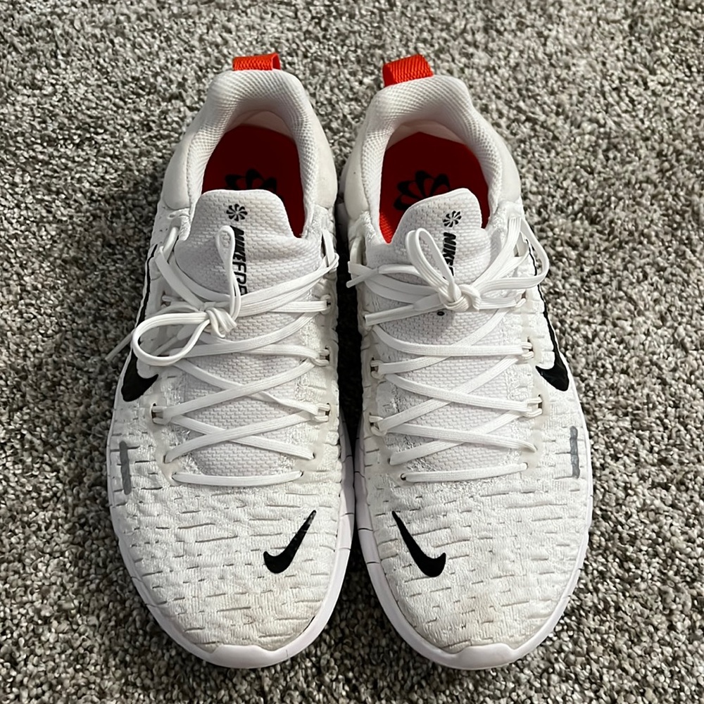 NIKE Free 5.0 in white with leopard detail print. Super cute!! Gently loved.